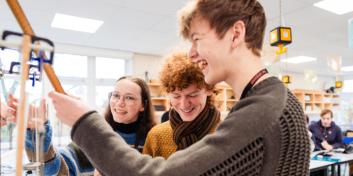 Physics students working on an experiment